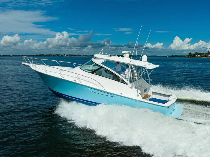 Galene Yacht Photos Pics 2013 Viking 42 Open yacht cruising on open water under a clear blue sky.