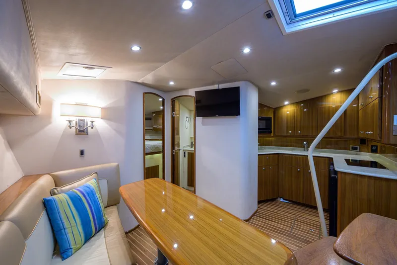 Galene Yacht Photos Pics Interior of 2013 Viking 42 Open yacht with modern kitchen and seating area.