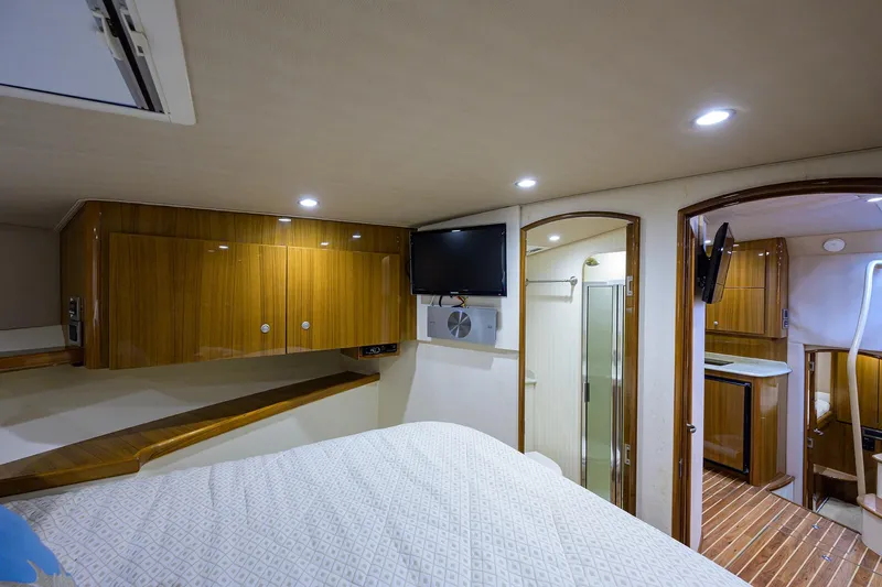 Galene Yacht Photos Pics Luxurious interior of 2013 Viking 42 Open yacht with wood cabinetry and modern amenities.