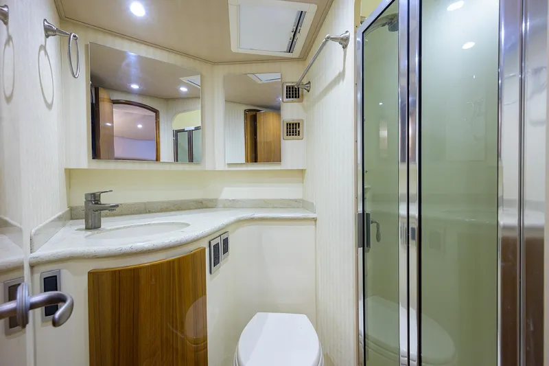 Galene Yacht Photos Pics Bathroom interior of 2013 Viking 42 Open yacht with shower and modern fixtures.