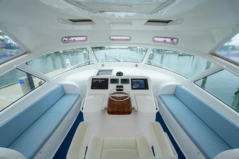 Galene Yacht Photos Pics Interior of 2013 Viking 42 Open yacht with modern helm and seating.