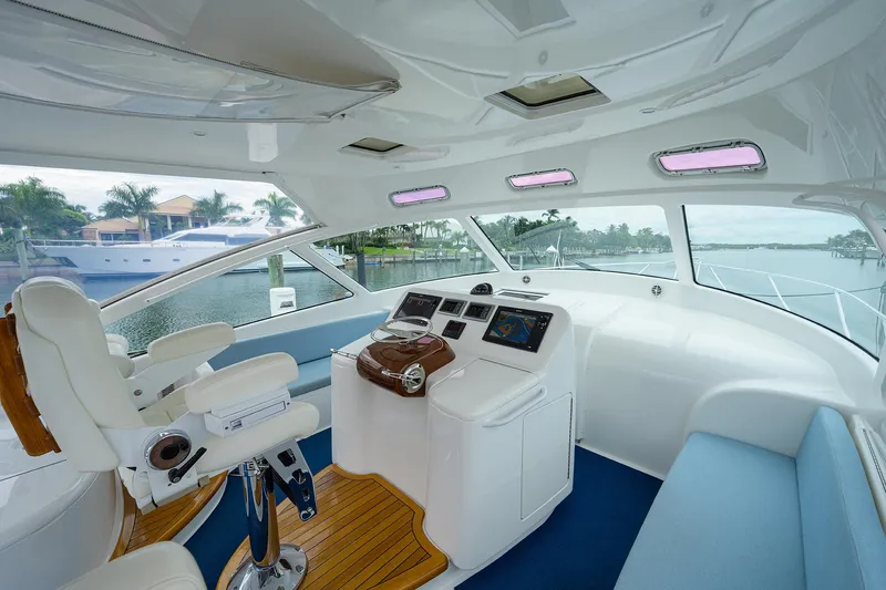 Galene Yacht Photos Pics Interior of 2013 Viking 42 Open yacht with modern helm and seating.