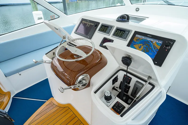 Galene Yacht Photos Pics Helm of 2013 Viking 42 Open yacht with navigation screens and controls.