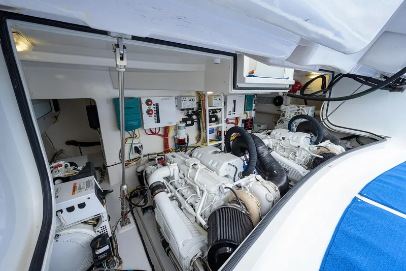 Galene Yacht Photos Pics Engine room of a 2013 Viking 42 Open yacht, showcasing dual engines and control systems.
