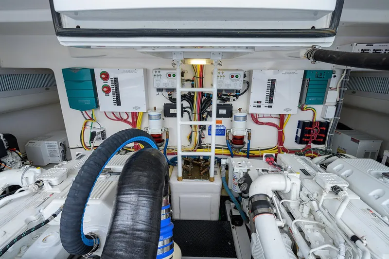 Galene Yacht Photos Pics Engine room of 2013 Viking 42 Open yacht, showcasing complex machinery and wiring.