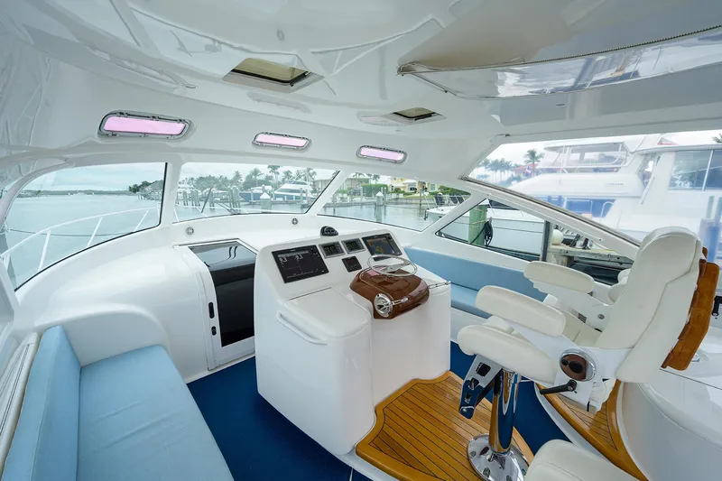 Galene Yacht Photos Pics Interior of 2013 Viking 42 Open yacht with modern helm and seating.