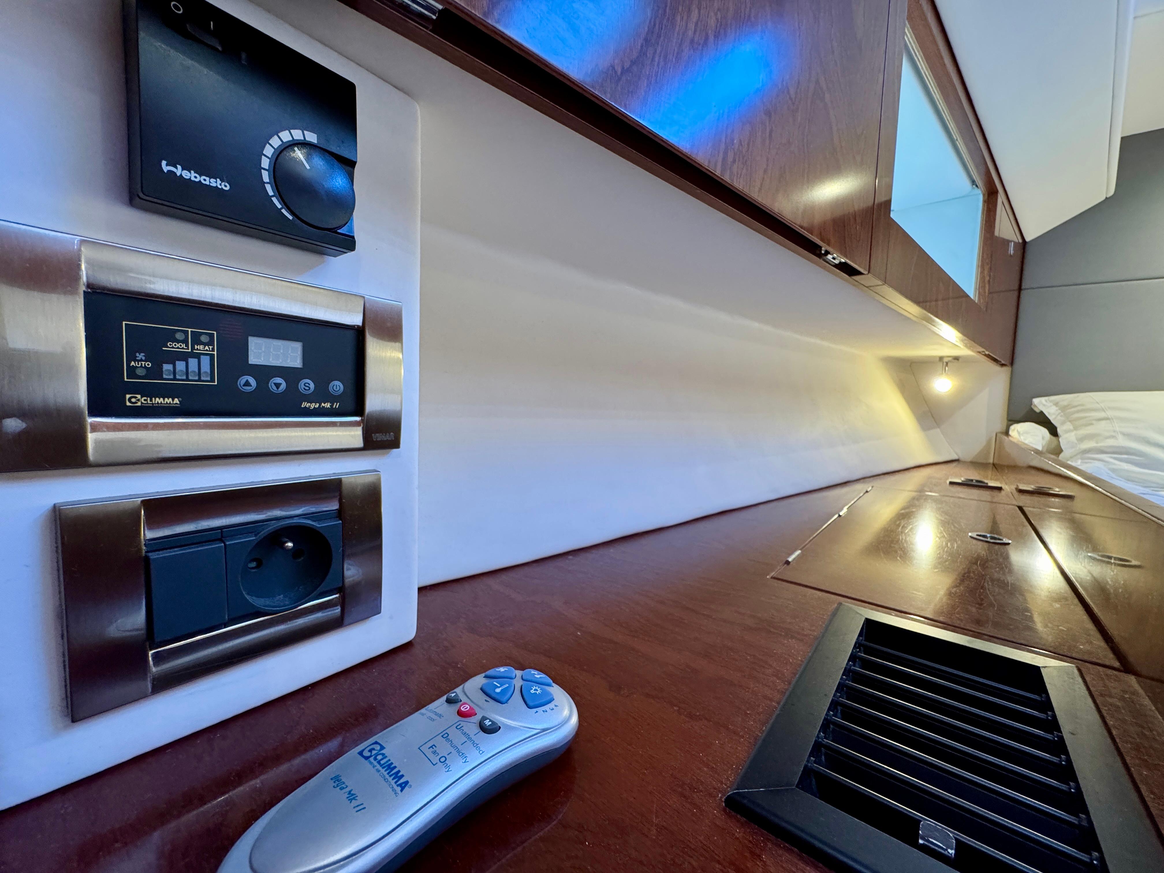 Control panel and remote in a 2015 Amel 55 yacht interior.