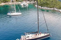 Aerial view of a 2019 Solaris 50 yacht anchored in a scenic coastal bay.
