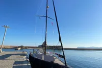 Sleek 2019 Solaris 50 yacht docked at a sunny marina.