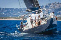 Sailing yacht Solaris 50, 2019 model, cruising in scenic coastal waters.