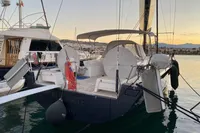 Solaris 50 yacht docked at sunset, 2019 model, in a serene marina setting.