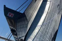 Sailing yacht Solaris 50, 2019 model, with large sails against a clear blue sky.