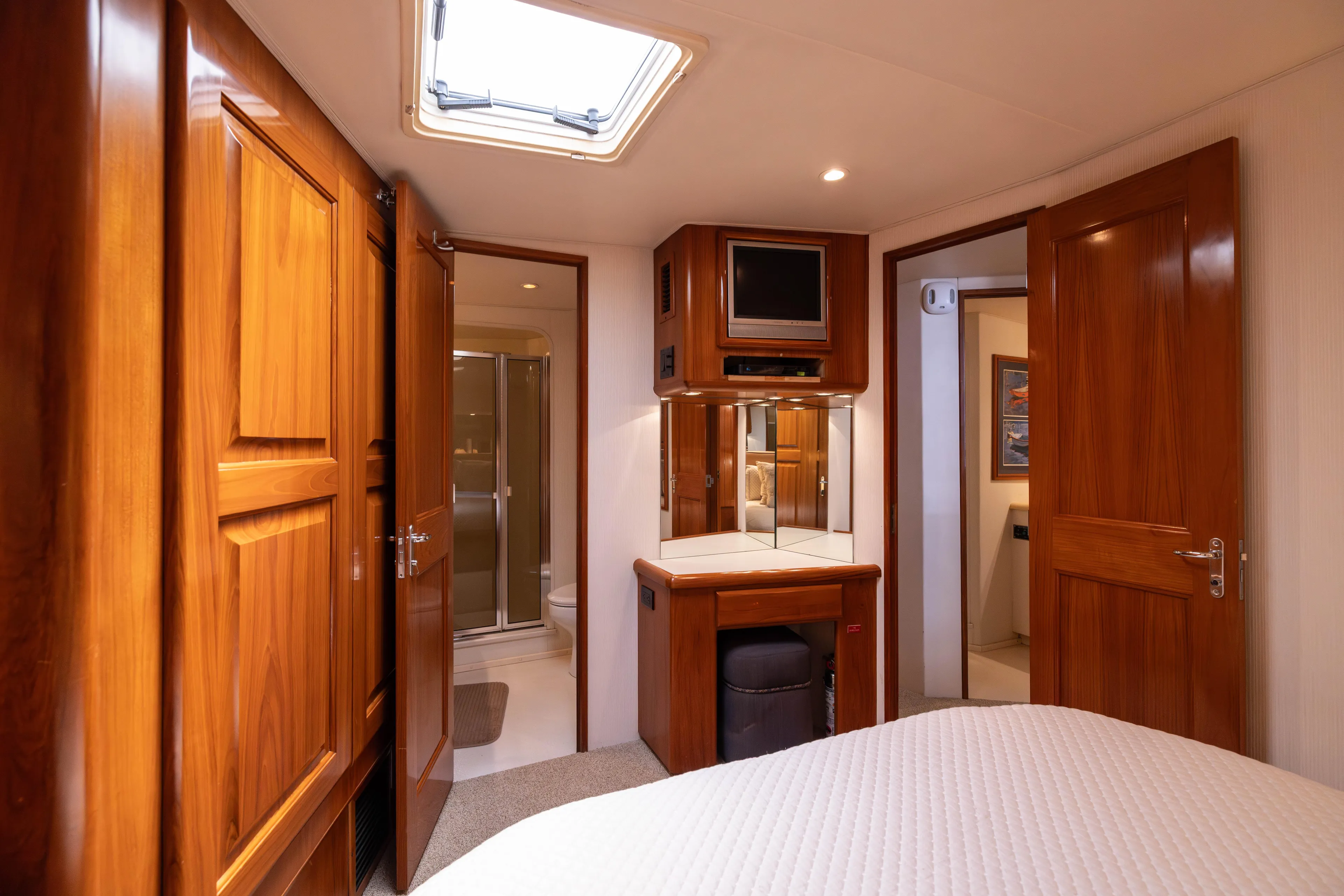 Fan Tail II Yacht Photos Pics Luxurious 1995 Viking Enclosed Bridge yacht interior with wood paneling and modern amenities.