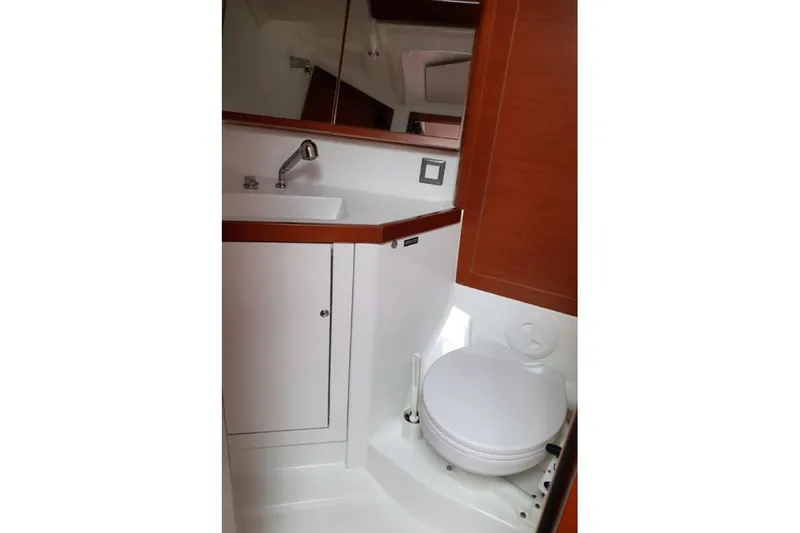 Yacht Photos Pics Bathroom interior of 2019 Beneteau Oceanis 46.1 yacht with sink and toilet.