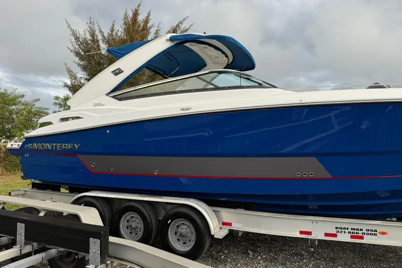  Yacht Photos Pics 2019 Monterey 328SS Super Sport boat on trailer, blue and white design.