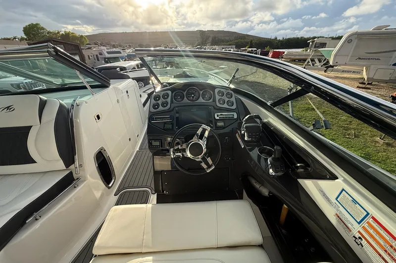  Yacht Photos Pics 2019 Monterey 328SS Super Sport boat interior with steering wheel and dashboard controls.