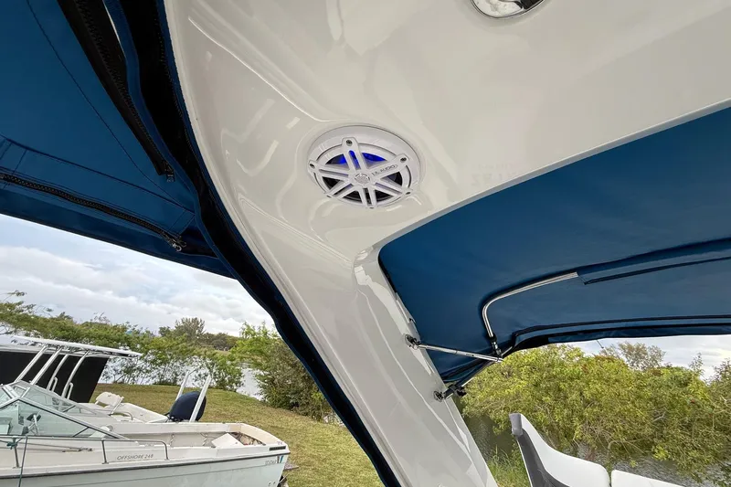 Yacht Photos Pics 2019 Monterey 328SS Super Sport boat with blue canopy and speaker system.
