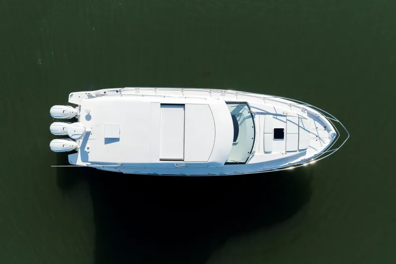 Our Trade Yacht Photos Pics Top view of a 2024 Regal 42 XO yacht on calm water.