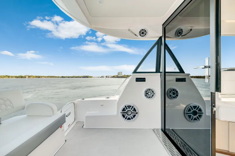 Our Trade Yacht Photos Pics 2024 Regal 42 XO yacht deck with seating and water view.