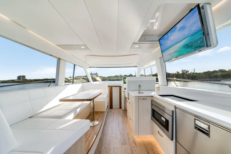 Our Trade Yacht Photos Pics Luxurious interior of 2024 Regal 42 XO yacht with modern amenities and scenic views.