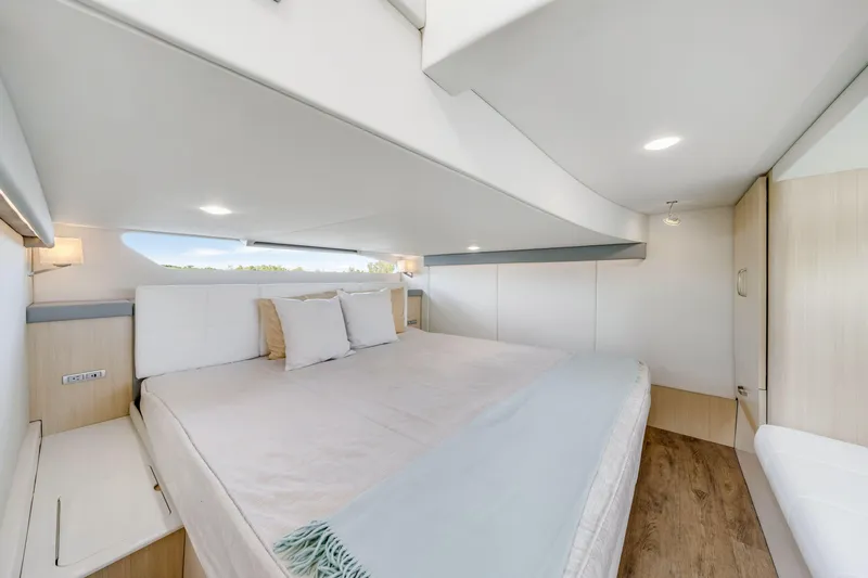 Our Trade Yacht Photos Pics Luxurious interior of 2024 Regal 42 XO yacht with spacious bed and modern design.