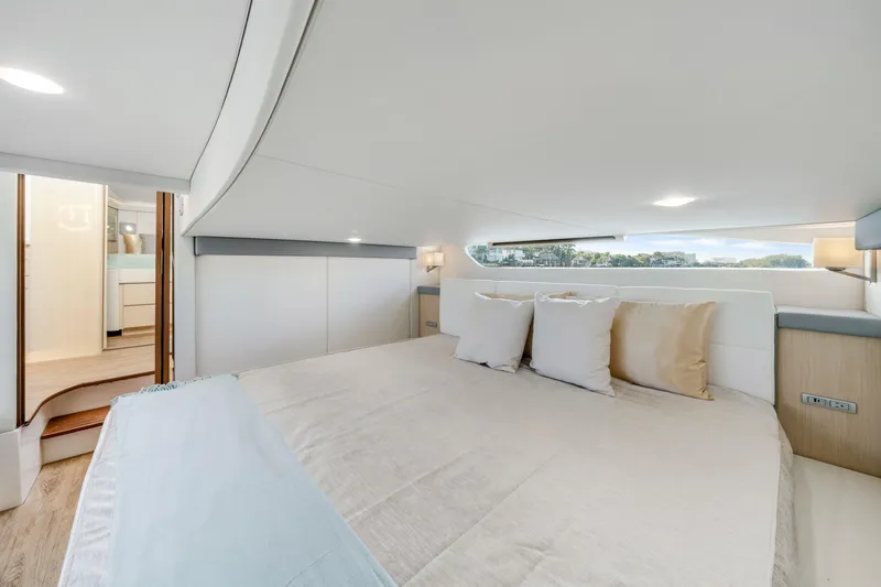 Our Trade Yacht Photos Pics Luxurious interior of 2024 Regal 42 XO yacht with elegant bedding and modern design.