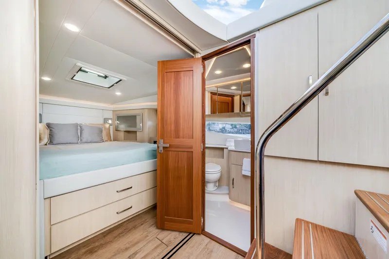 Our Trade Yacht Photos Pics Luxurious interior of 2024 Regal 42 XO yacht with bedroom and bathroom.