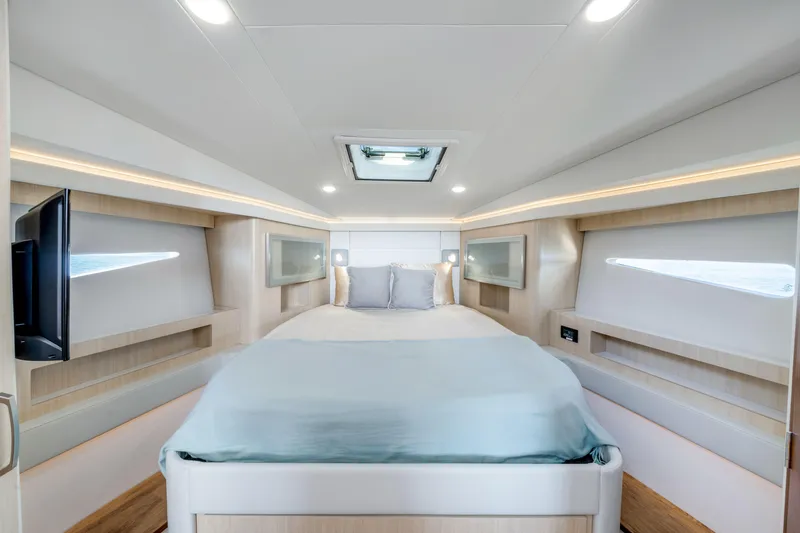 Our Trade Yacht Photos Pics Luxurious interior of 2024 Regal 42 XO yacht with modern bedroom design.
