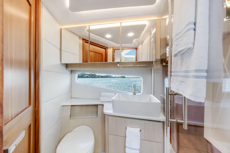 Our Trade Yacht Photos Pics Luxurious bathroom interior of 2024 Regal 42 XO yacht with modern fixtures and ocean view.