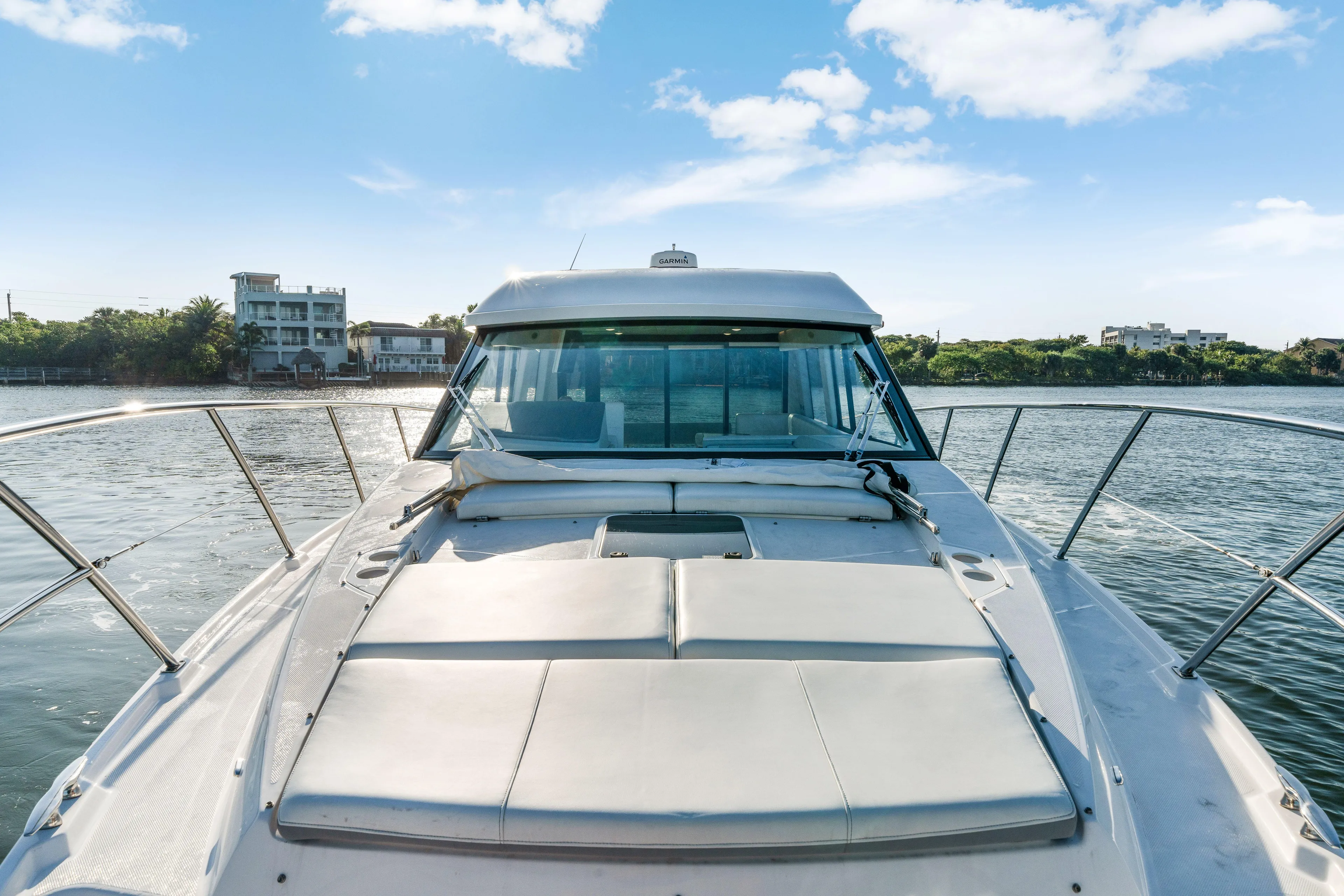 Our Trade Yacht Photos Pics 2024 Regal 42 XO yacht on water, showcasing sleek design and spacious deck.