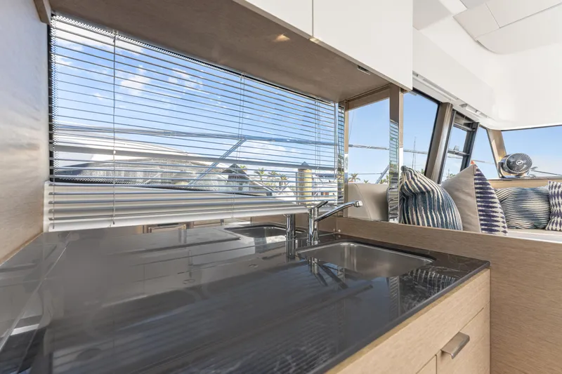 Next Waypoint Yacht Photos Pics Interior of 2020 Prestige 420 Flybridge yacht with modern kitchen and window view.