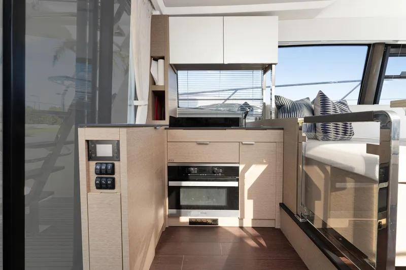 Next Waypoint Yacht Photos Pics Modern kitchen interior on 2020 Prestige 420 Flybridge yacht, featuring sleek cabinetry and appliances.