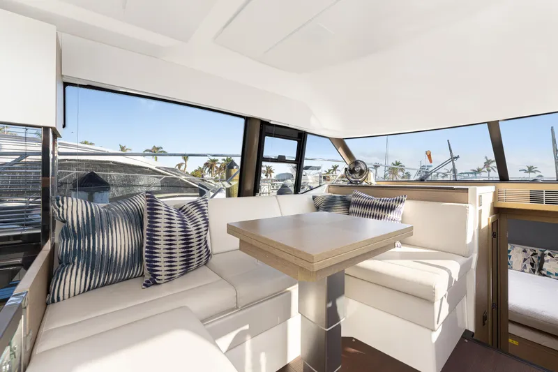 Next Waypoint Yacht Photos Pics Luxurious interior of 2020 Prestige 420 Flybridge yacht with elegant seating and table.