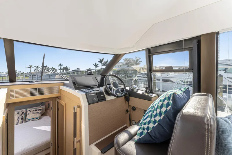 Next Waypoint Yacht Photos Pics Interior of 2020 Prestige 420 Flybridge yacht with helm, seating, and scenic view.