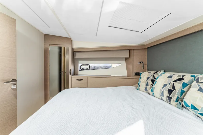 Next Waypoint Yacht Photos Pics Luxurious bedroom interior of 2020 Prestige 420 Flybridge yacht with modern decor.