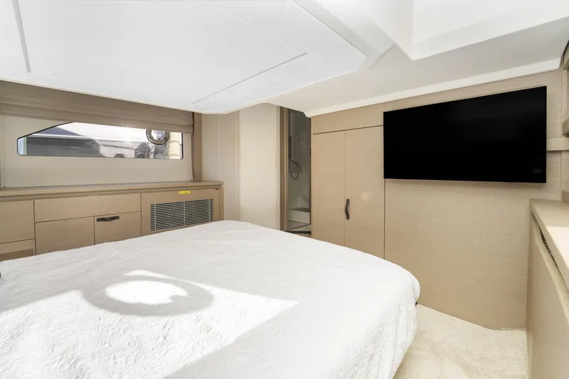 Next Waypoint Yacht Photos Pics Luxurious bedroom interior of 2020 Prestige 420 Flybridge yacht with modern amenities.