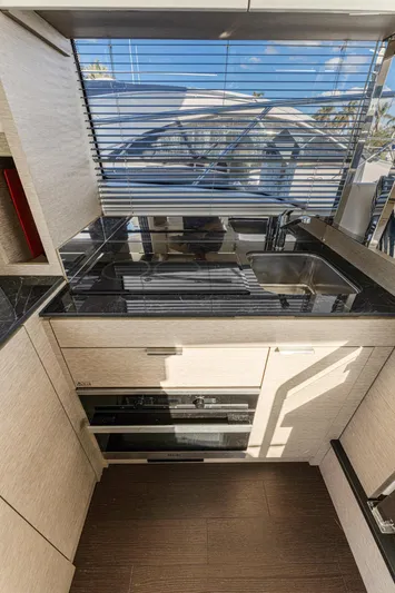 Next Waypoint Yacht Photos Pics Modern kitchen interior of 2020 Prestige 420 Flybridge yacht with sleek countertops.