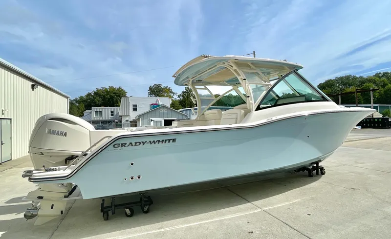  Yacht Photos Pics 2025 Grady-White Freedom 325 boat with Yamaha engine, parked outdoors.