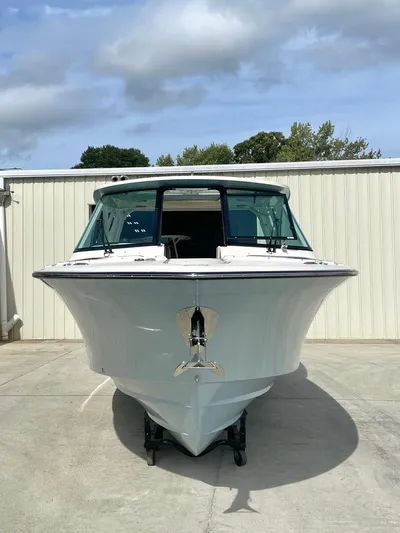  Yacht Photos Pics 2025 Grady-White Freedom 325 boat, front view, parked on concrete under cloudy sky.