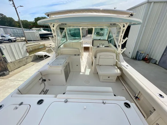  Yacht Photos Pics 2025 Grady-White Freedom 325 boat interior, featuring spacious seating and modern amenities.