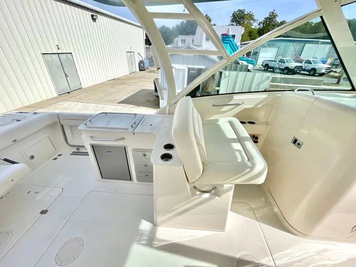  Yacht Photos Pics 2025 Grady-White Freedom 325 boat interior with seating and storage.