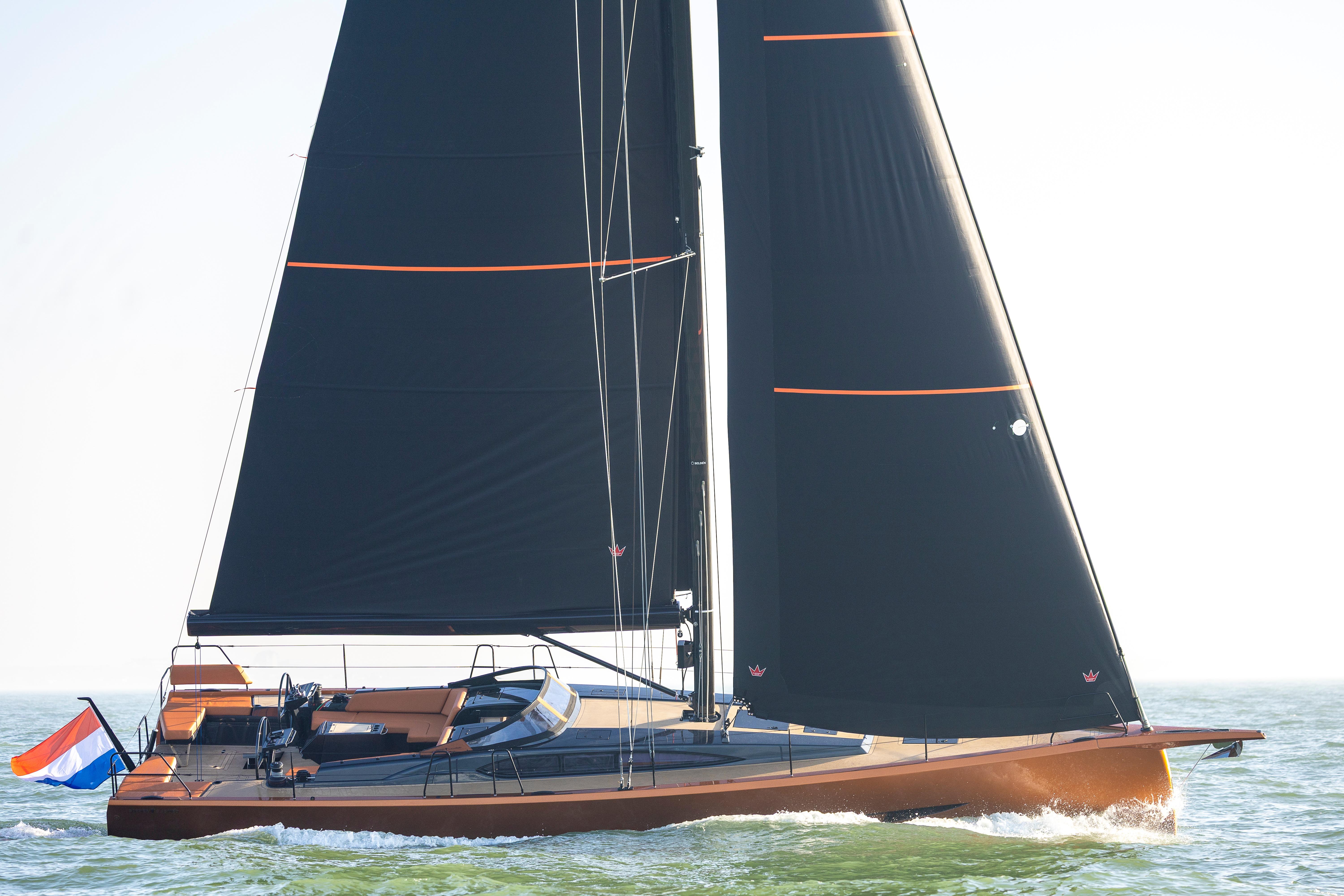 Saffier SL 46 MED 2027 sailing yacht with sleek black sails on open water.