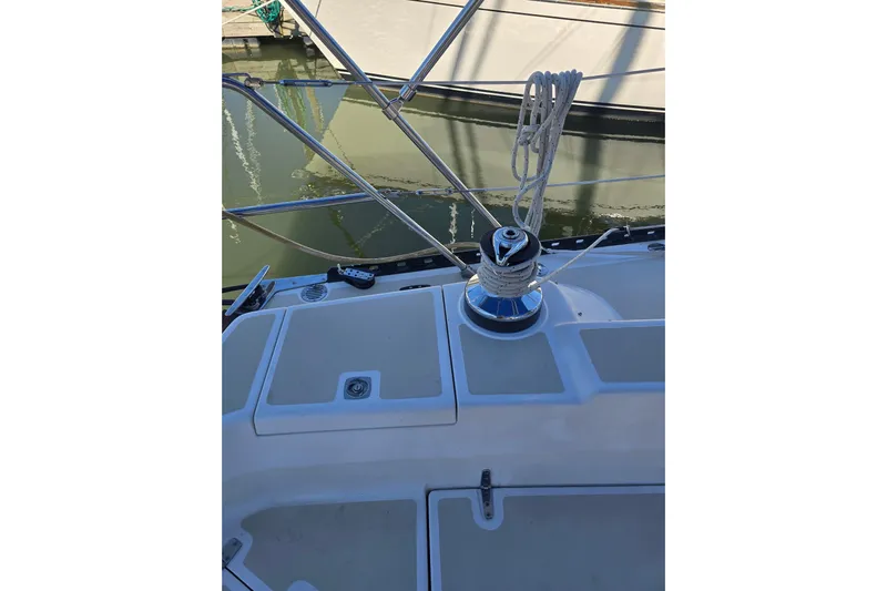 Sail Fourth Yacht Photos Pics Tartan 3700 sailboat deck with winch and ropes, 2001 model, docked by water.