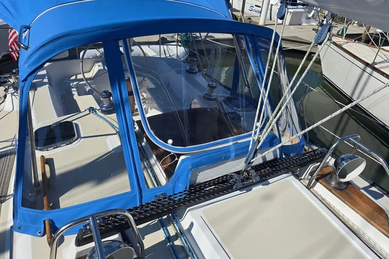 Sail Fourth Yacht Photos Pics Tartan 3700 sailboat cockpit with blue canopy, docked in marina, 2001 model.