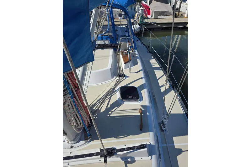 Sail Fourth Yacht Photos Pics Sailboat deck view of 2001 Tartan 3700, featuring rigging and blue canopy.