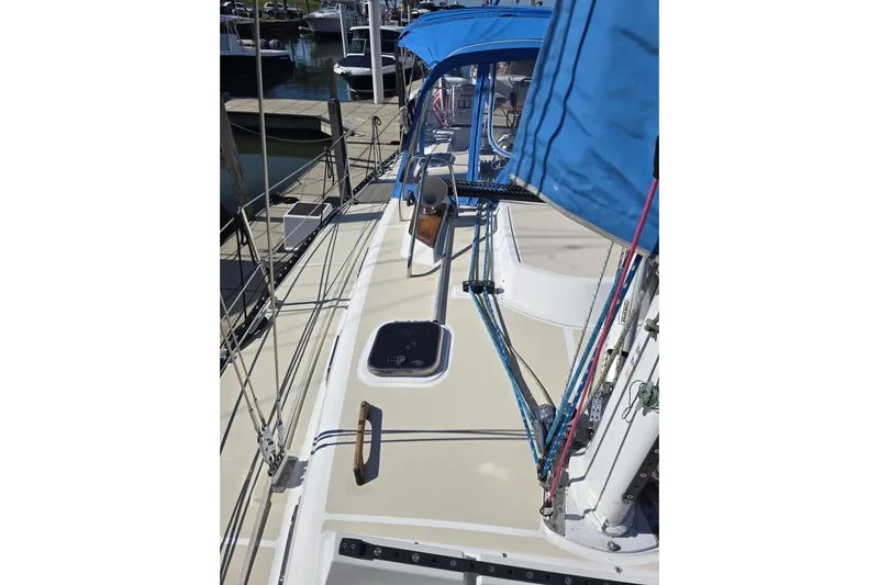 Sail Fourth Yacht Photos Pics 2001 Tartan 3700 sailboat deck with blue canopy and rigging in marina.