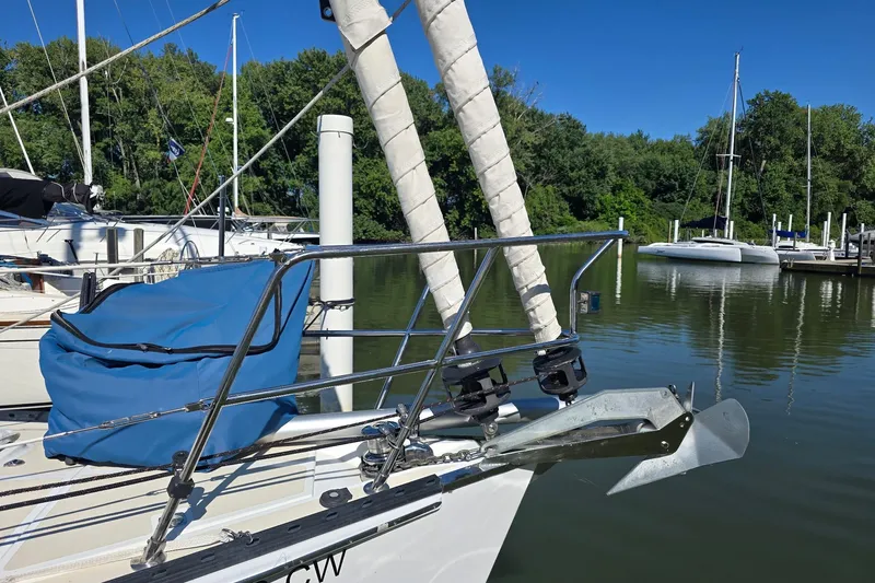 Sail Fourth Yacht Photos Pics Sailboat Tartan 3700 (2001) docked, featuring anchor and blue sail cover.
