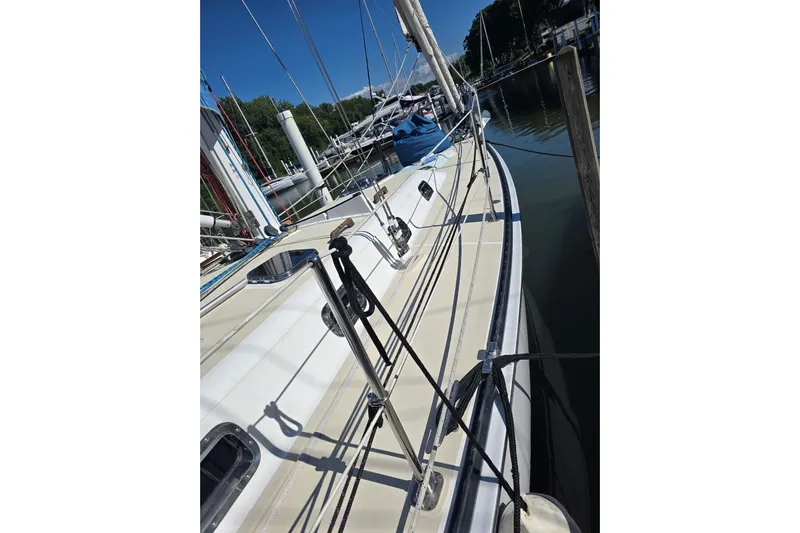 Sail Fourth Yacht Photos Pics Sailboat docked at marina, Tartan 3700 model, 2001, with clear blue sky.