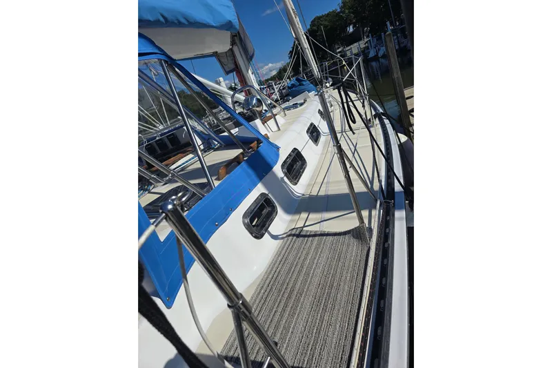 Sail Fourth Yacht Photos Pics Sailboat deck view of 2001 Tartan 3700 with blue accents and railing.