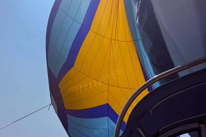 Sail Fourth Yacht Photos Pics Colorful sail on Tartan 3700 yacht, 2001 model, against clear blue sky.
